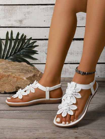 Damen Sandalen mit Blumenapplikation und Fersenriemen von oben