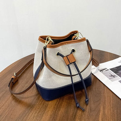 Canvas-Eimer-Tasche mit veganem Lederbesatz und Kordelverschluss