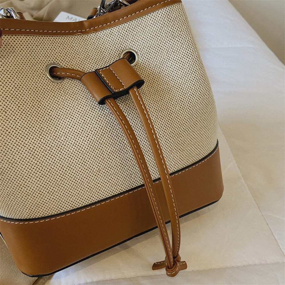 Canvas-Eimer-Tasche mit veganem Lederbesatz und Kordelverschluss