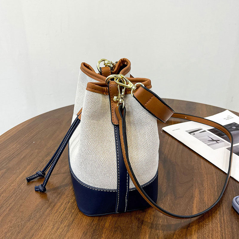 Canvas-Eimer-Tasche mit veganem Lederbesatz und Kordelverschluss