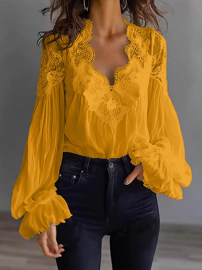 Damenbluse mit Spitzen-Patchwork und Puffärmeln